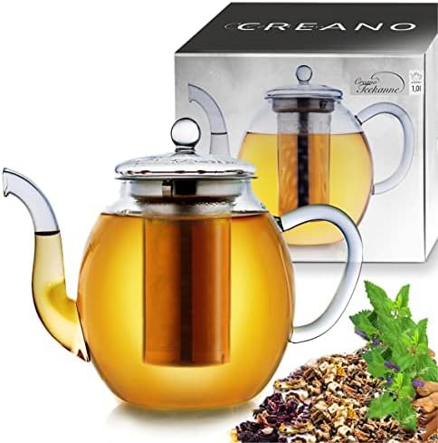 Glass teapot with integrated stainless strainer